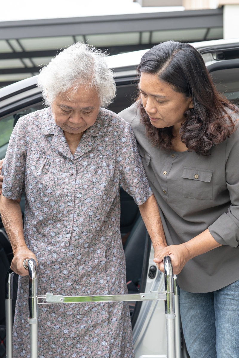 care taker happily teaching elder